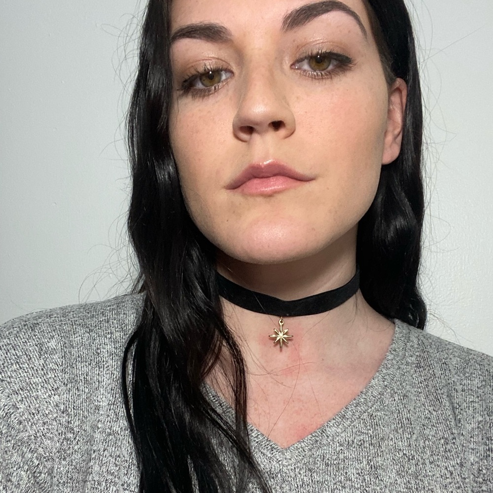 Black choker with golden star pendant